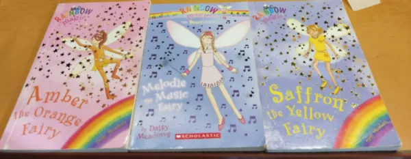 Vedd meg online 3 db Rainbow Magic: Amber the Orange Fairy + Melodie the Music Fairy + Saffron the Yellow Fairy